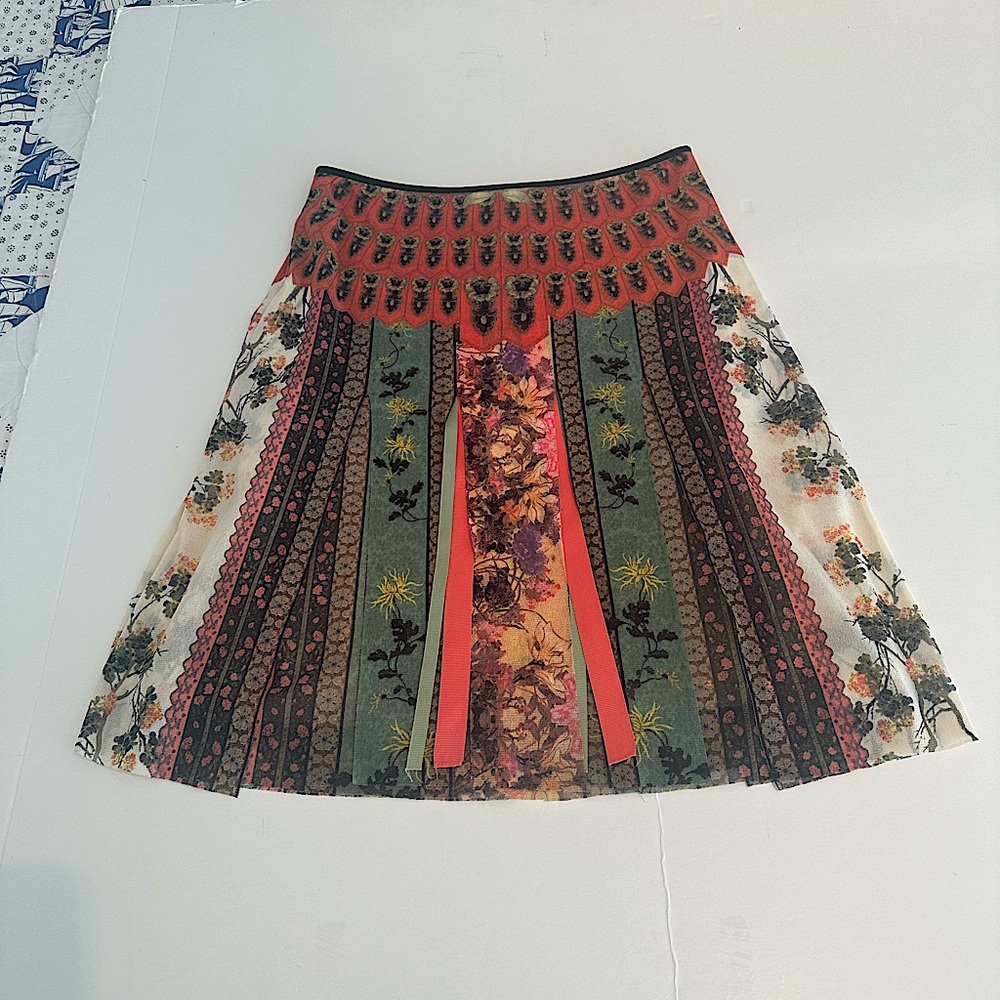 Vivienne Tam flirty knee length skirt with layered panels and ribbons.